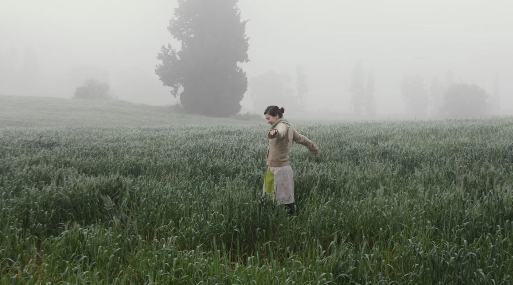 Woman in dewy field